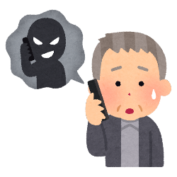 詐欺電話に出る男の画像